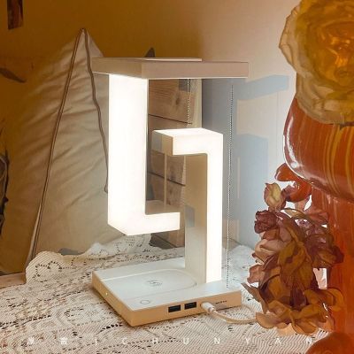Anti gravity led desk lamp with wireless charger